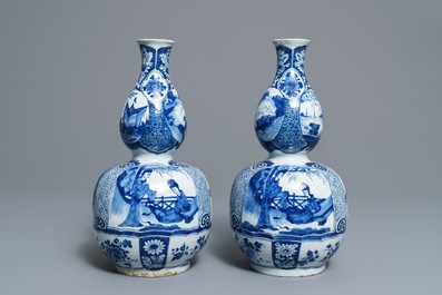 A pair of Dutch Delft blue and white double gourd chinoiserie vases, 18th C.